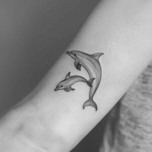 water-animals tattoo design ideas Realism textured skin flowing motion for lower arm
