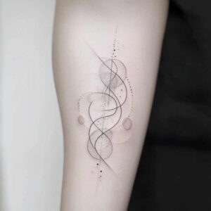 Black and grey abstract tattoo on forearm with circles, lines, and dots; a tattoo project; not specifically a cover-up.