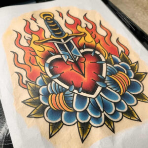 Heart and dagger tattoo with blue petals and orange flames; red heart, blue flower, orange flames, black outlines; tattoo project concept, not a cover-up.