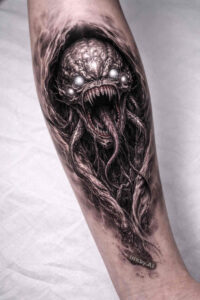 Black and grey tentacled eldritch creature tattoo design on forearm; AI-generated project idea, cover-up-ready.