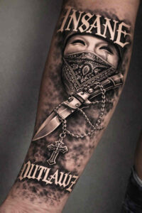 Black and grey realism tattoo design on forearm featuring an outlaw with a masked bandana and bold text, AI-generated concept for a cover-up project.