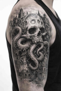Black and grey tattoo concept of a skull entwined by octopus tentacles over a dark city; a project idea, cover-up suitable.