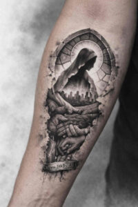 Wolf in circular frame on forearm, black and grey tattoo; project idea, cover-up ready.
